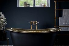 15 charcoal grey bathroom with brass accents and a retro free-standing bathtub