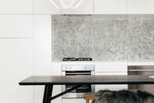 15 minimalist white kitchen is spruced up with grey tiles of various tones