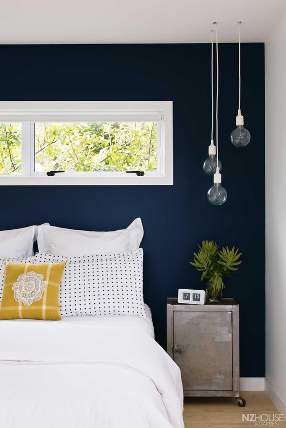 navy accent wall for a neutral guest bedroom