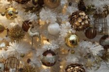 15 vintage-inspired gold ornaments in a faux white tree
