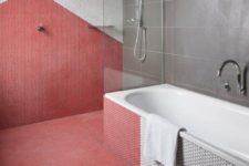 16 penny tiles create a geometric pattern in a different shade on the wall and floor