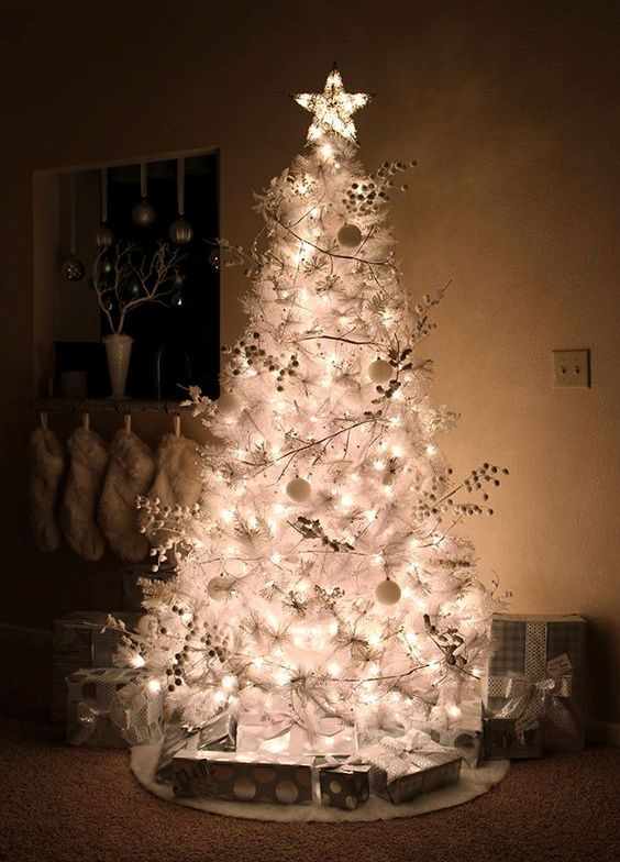 silver and white Christmas tree with ball ornaments