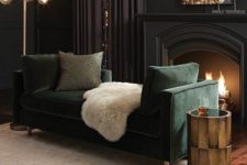 16 soft black living room with a dark green sofa, art deco lights and a working fireplace