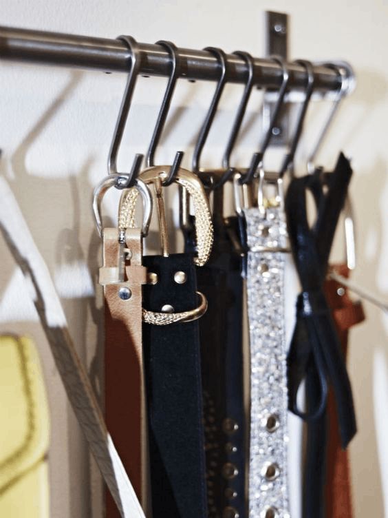 hang your belts and sashes on S-shaped hooks is a clever idea to squeeze some extra storage space