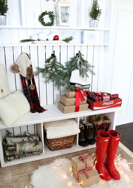 red rainboots and gift boxes for a winter hallway