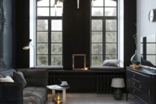 17 small dark sitting room, chic modern furniture and a unique brass chandelier