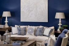 19 blue accent wall with cream fabric and dark wood for living room
