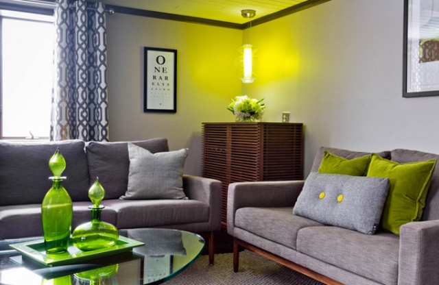 clean-lined and comfortable seating area with lime green decorations