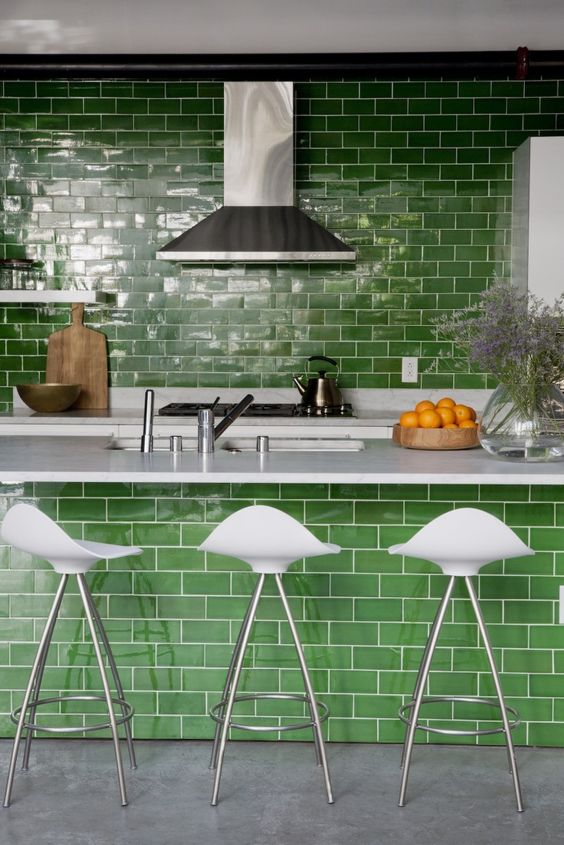 grass green subway tiles as a backsplash and on the kitchen island infuse this kitchen with color still keeping it quite traditional thanks to the type of the tile