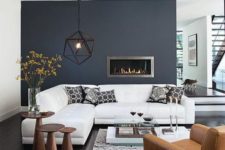 21 highlight the fireplace with a dark grey acent wall in a neutral living room