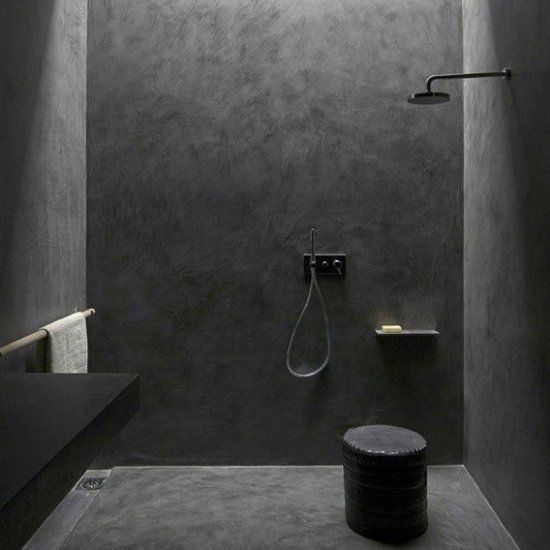 ultra-minimalist black shower space made with concrete