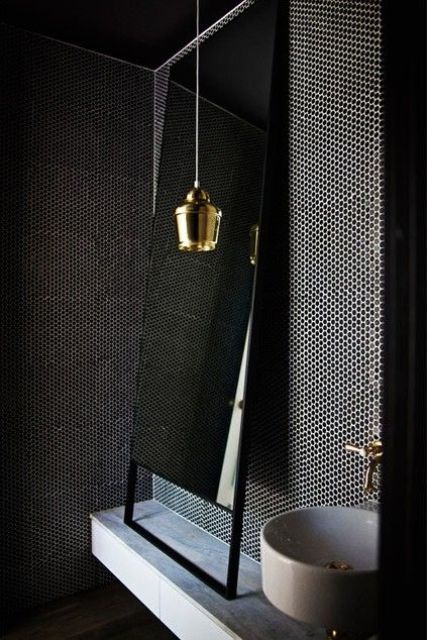 choose a textured dark wall to give a luxurious and bold look to your bathroom