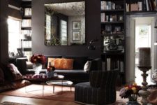 22 dark living room with black walls, colorful accessories and various textiles