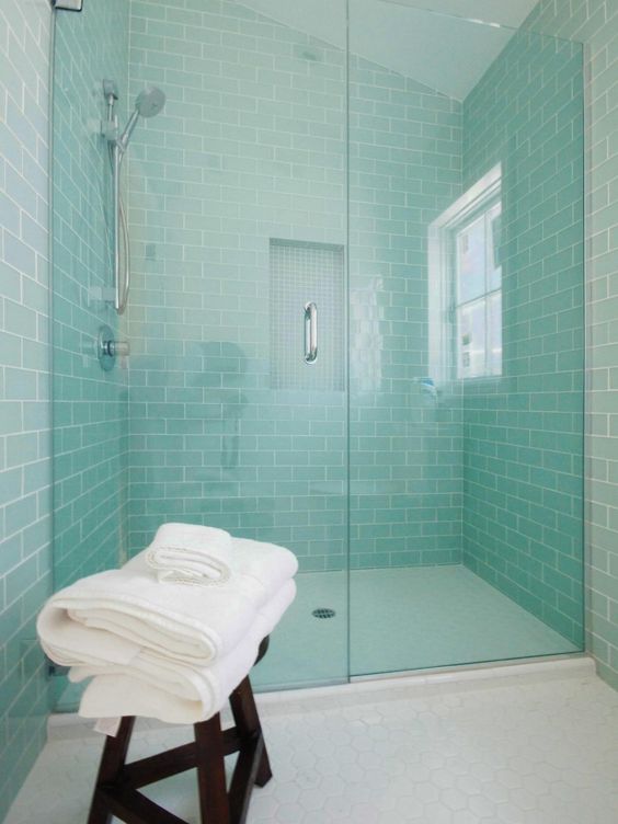 Accent your shower space with mint colored subway tiles, which raise the spirits and add color to the space