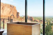 22 wooden soaking bathtub with a view