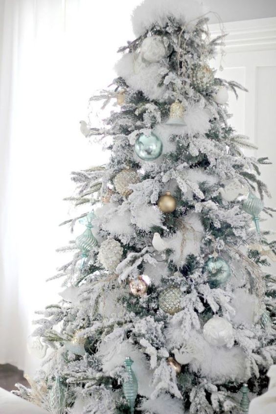 fluffy snowy tree with pastel ornaments