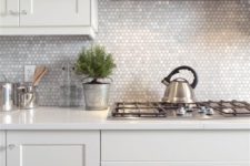23 mother-of-pearl penny tile backsplash will reflect the light