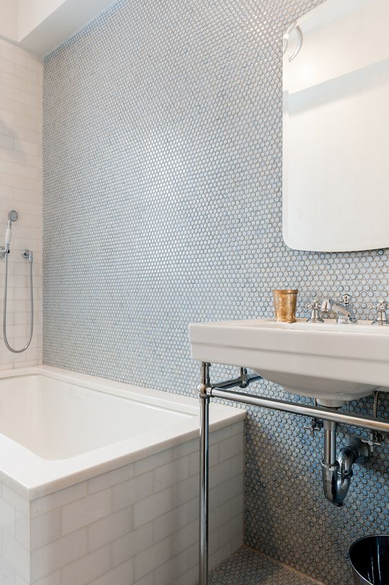 penny tiles in blue shades done right with subway tiles on the bathtub