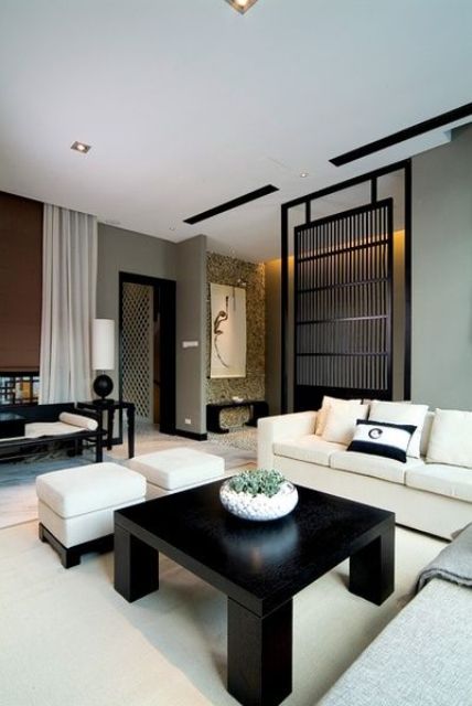 Zen interior with a black bamboo screen for separating zones