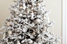 24 fresh and modern snowy tree with silver ornaments