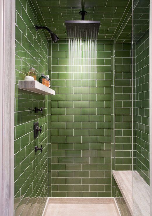 a modern shower space fully clad with green subway tiles for a catchy and welcoming look is a good idea as green shades make you feel relaxed