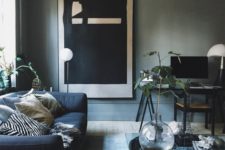 24 grey walls, a navy sofa and a modern large scale artwork