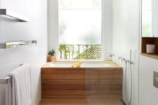 25 cover a usual soaking tub with wood and the shower space also to achieve that Japanese-inspired look