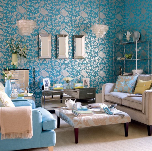 damask print wallpaper, beige upholstery and bright blue accessories