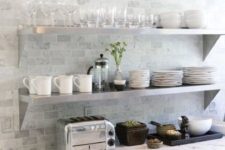 white farmhouse cabinets with white stone countertops and marble-looking subway tiles for delicate and subtle decor