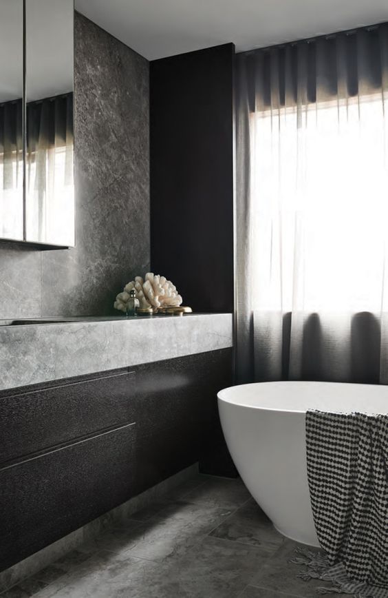 minimalist bathroom decor with dark wood, grey marble