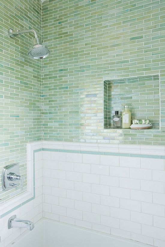 skinny green tiles paired with white subway ones look very stylish, fresh and natural, get some for your bathing space