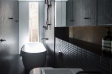 27 modern black bathroom clad with small tiles that add the space eye-catchy