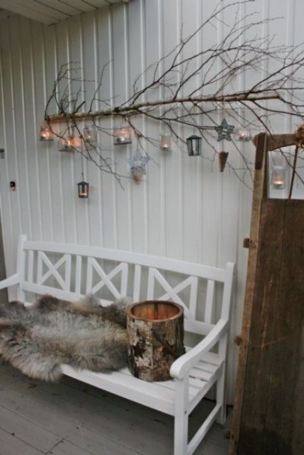 attach a branch with lanterns on the wall and add a fur throw