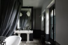 29 moody vintage bathroom with white sinks and a bathtub, vintage furniture makes up the space