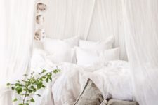 29 rustic bedroom with crispy white draperies over the bed