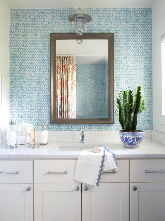 tiles in the shades of blue to give the bathroom a seaside touch