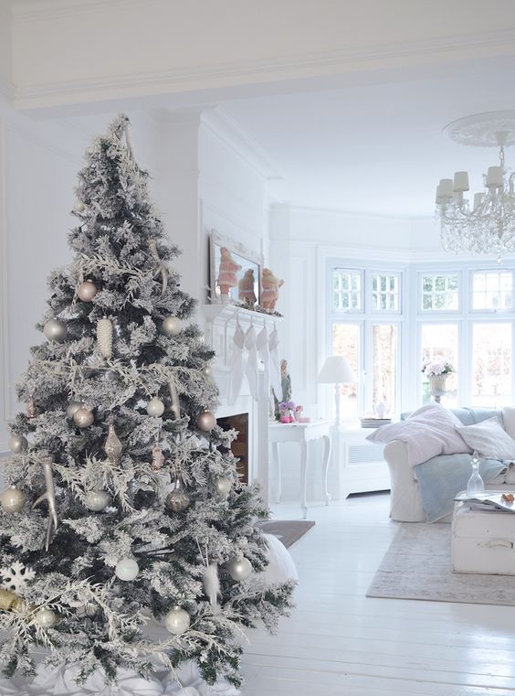 snowy Christmas tree with white and silver ornaments