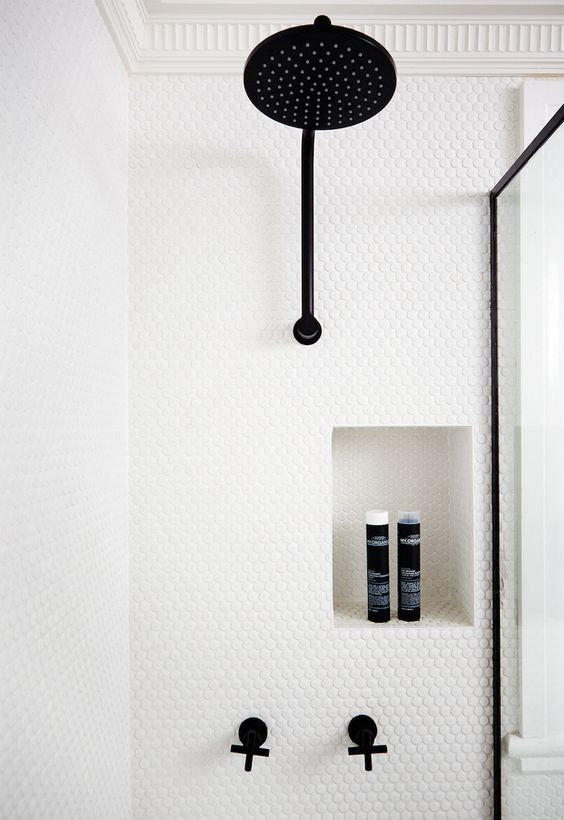 white penny tiles contrast with black fittings