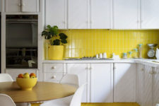 vertical stack bond clad subway tiles in this kitchen add a pop of color and pattern and make the space cooler and catchier