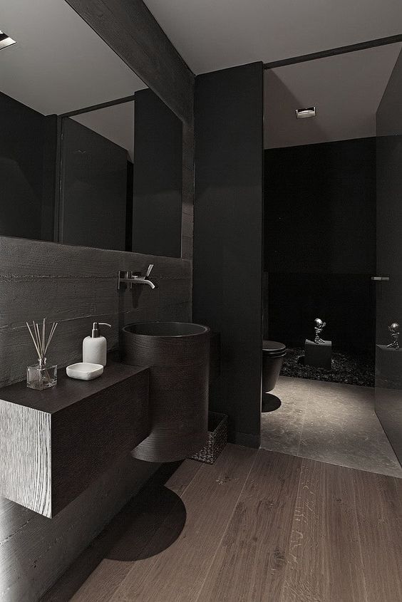 this minimalist bathroom looks cool beacuse of wood and stone textures