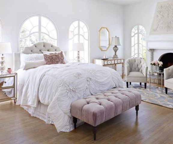 a tufted headboard echoes with a tufted bench