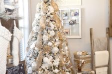 34 this white tree got a rustic vibe with burlap garlands and white ornaments