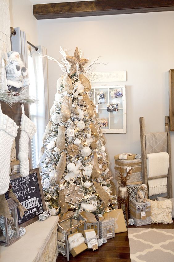 this white tree got a rustic vibe with burlap garlands and white ornaments