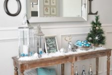 35 light blue ornaments and a pillow with a snowflake