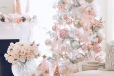 a charming white Christmas tree with pastel pink and green ornaments, ribbons and branches is a very catchy idea