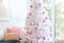 bold pink, gold, pearly and copper ornaments with a bold top bow are nice on a white tree