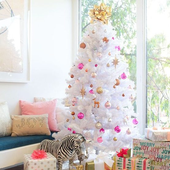 bold pink, gold, pearly and copper ornaments with a bold top bow are nice on a white tree
