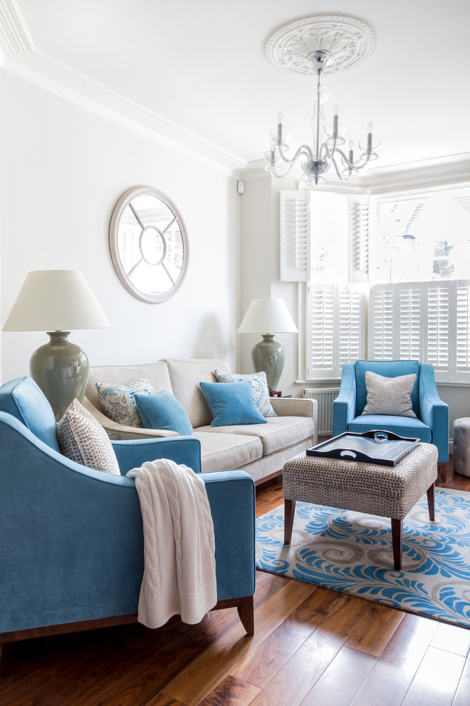 Even such thing as a hardwood floor mixes great with light blue upholstery. (Town House Interiors)