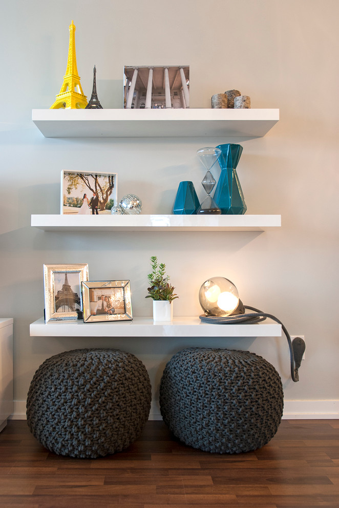 Display the stuff you bring from travels. Floating shelves provides lots of space to do that without looking too bulky. (Heather Merenda)
