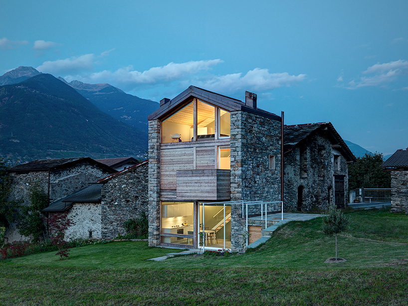 Architect Rocco Borromini added a timber facade to a stone cottage in the Alps